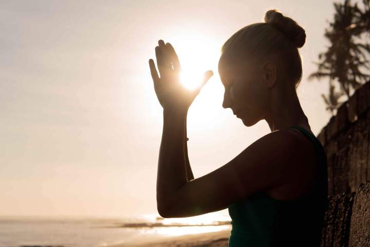 beautiful woman meditating outdoors 11zon